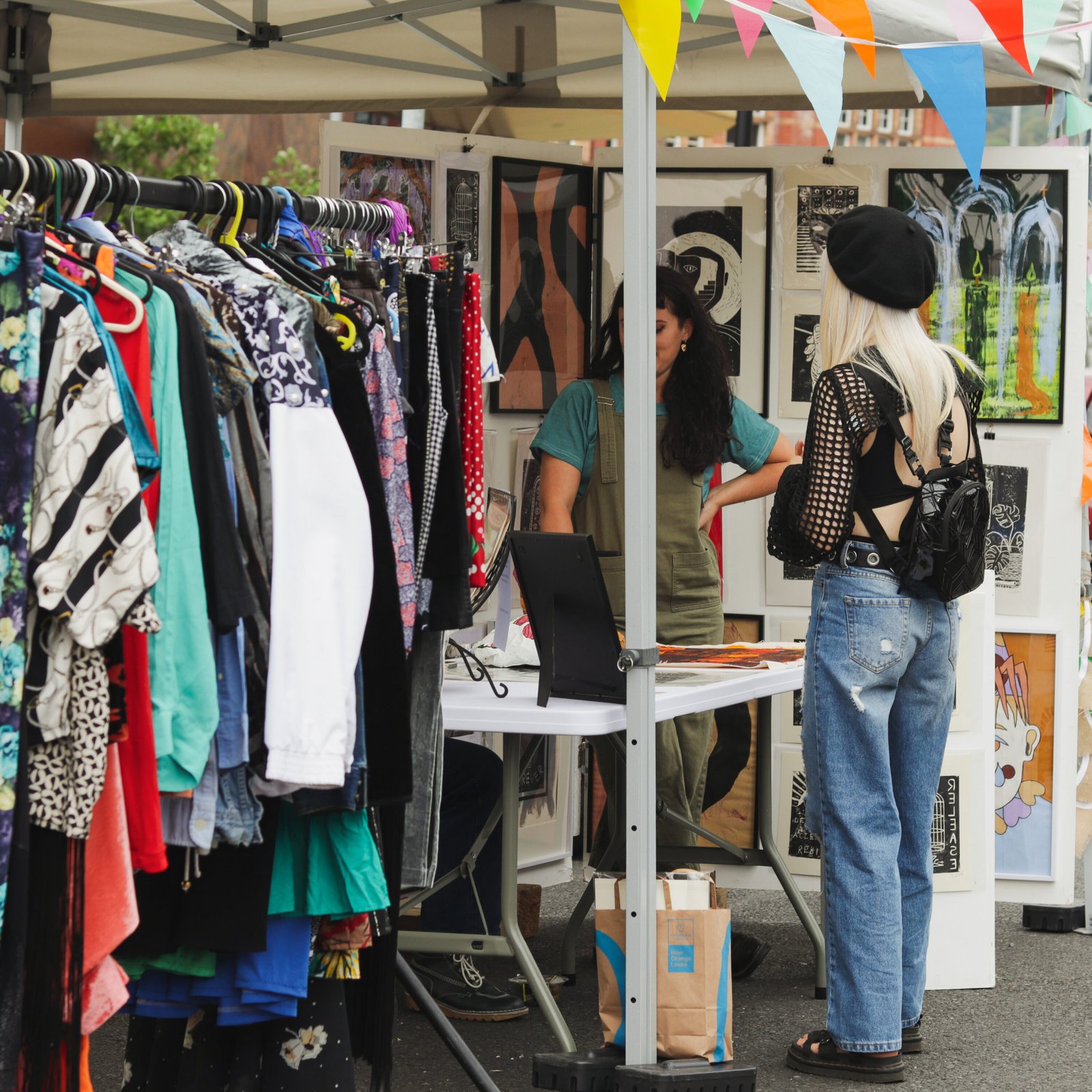 Female shopper visitng a stall with ladies fashion at a Not Only a Street Market event in Blackburn