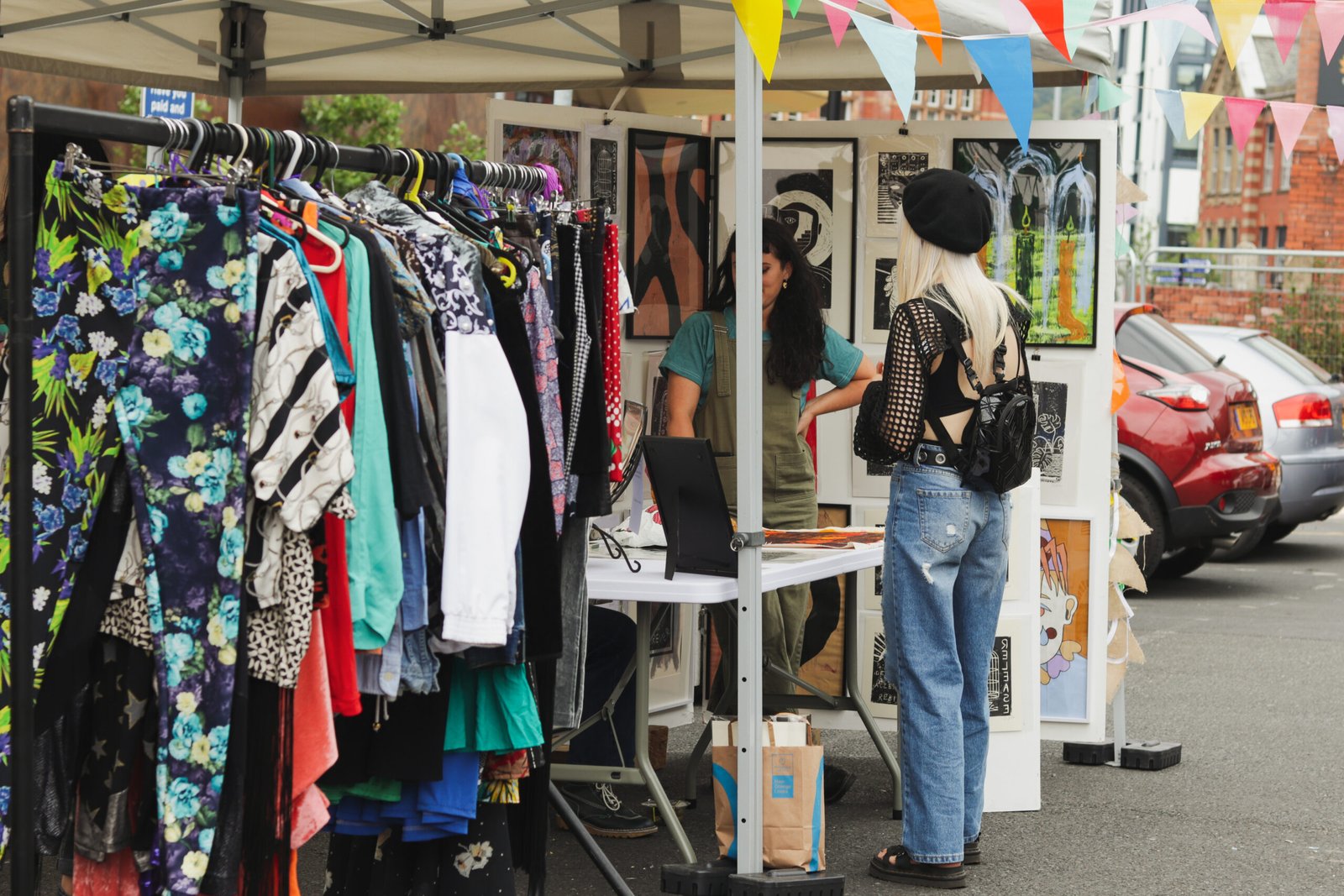 Female shopper visitng a stall with ladies fashion at a Not Only a Street Market event in Blackburn